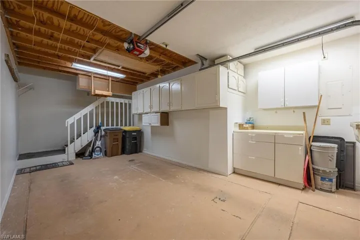 Garage featuring a garage door opener