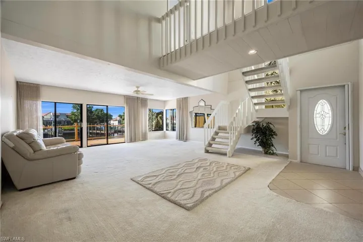 Living room with a high ceiling and plenty of natural light