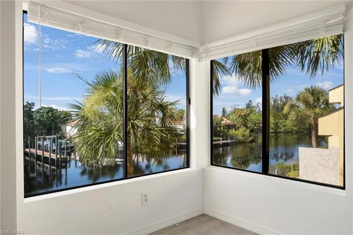 Unfurnished sunroom with a water view