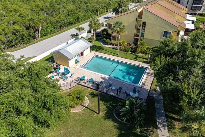 View of swimming pool with a lawn and a patio area