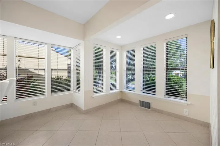 Unfurnished room with a wealth of natural light and light tile patterned floors