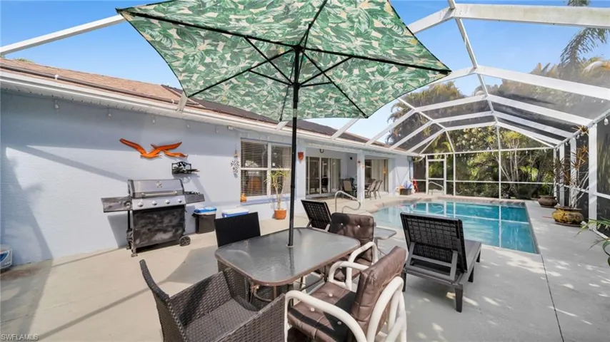 Screened lanai featuring a swimming pool, concrete decking, and direct access to interior spaces