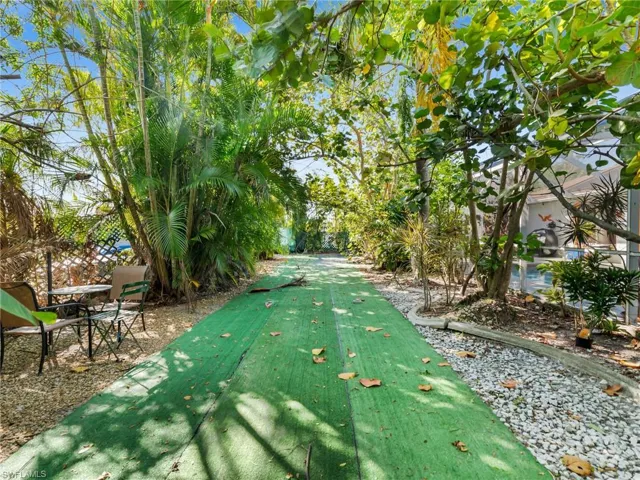 View of home's community featuring a putting green