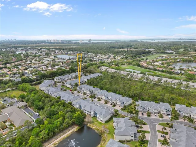 Aerial overview of property's location featuring a large body of water and nearby suburban area