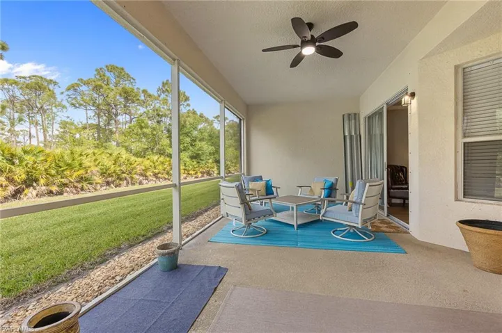Sunroom / solarium featuring ceiling fan