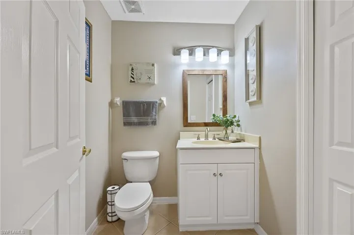 Bathroom featuring vanity and light tile patterned floors