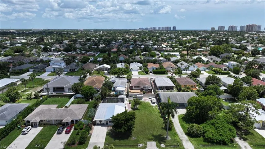 View of property location featuring nearby suburban area and city skyline