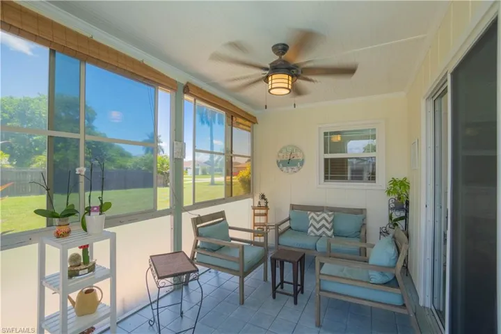 Sunroom / solarium with a ceiling fan, plenty of natural light, and an outdoor hangout area