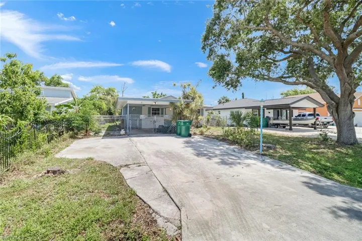 Single story home with a carport