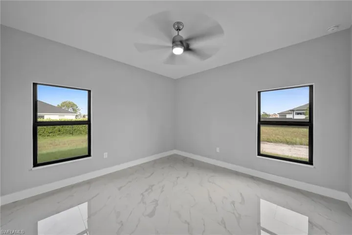 Spare room with ceiling fan