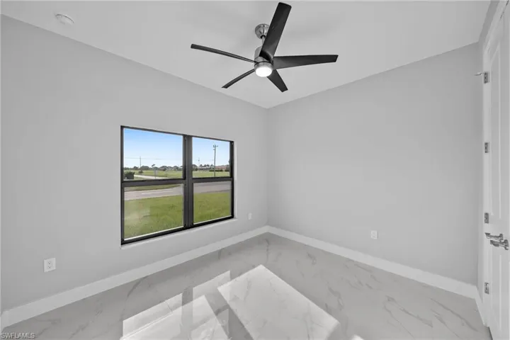 Spare room featuring ceiling fan