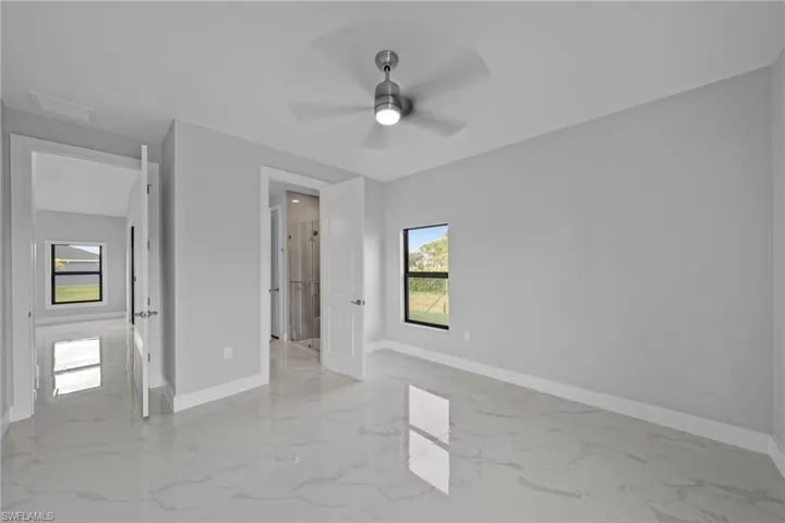 Unfurnished bedroom featuring ceiling fan