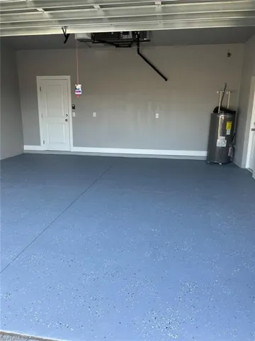 Garage featuring water heater