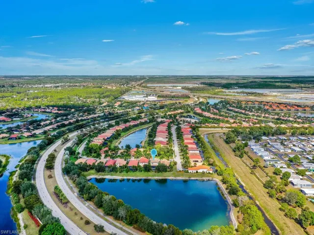 Aerial perspective of suburban area with a nearby body of water