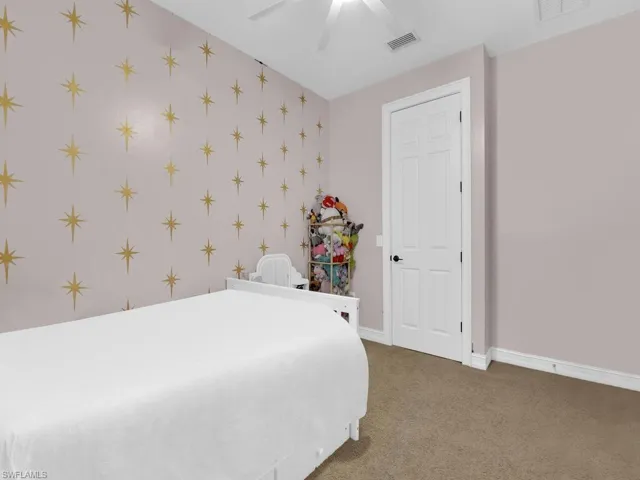 Bedroom with carpet floors and ceiling fan