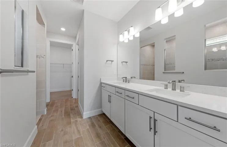 Bathroom with a tile shower and vanity