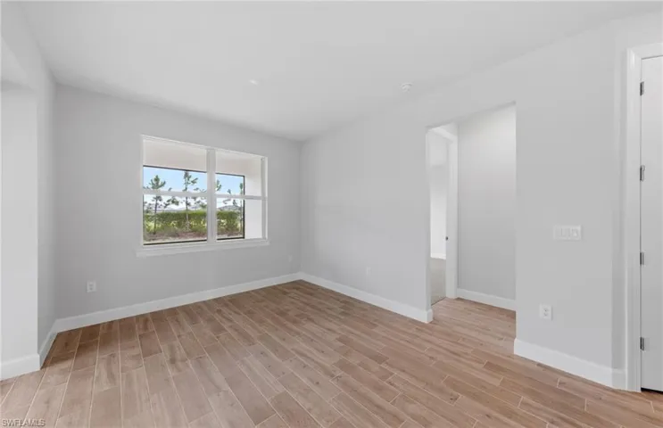Empty room with light wood-type flooring