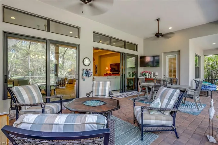 View of patio w/ two separate sliding glass doors