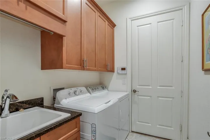 Laundry room with cabinet space and separate washer and dryer