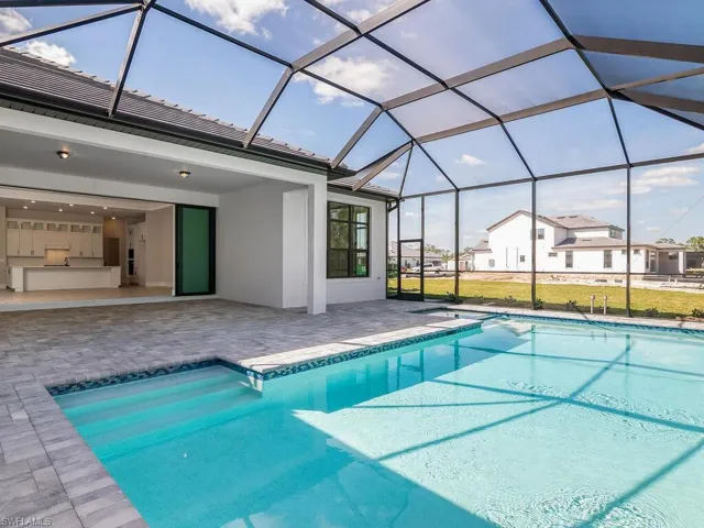 Plenty of outdoor space for relaxing or entertaining poolside, with custom heated pool and spa.
