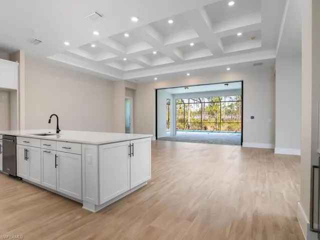 Impact Sliding Doors in great room are pocketing, making a seamless transition from the indoor to the outdoor space.