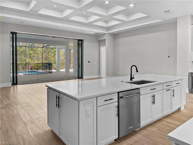 Plenty of storage in upgraded cabinets with large center island.