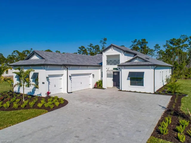 Note the oversize 3 car garage, extra-wide driveway, gorgeous welcoming entryway, bermuda shutters and beautiful home details.