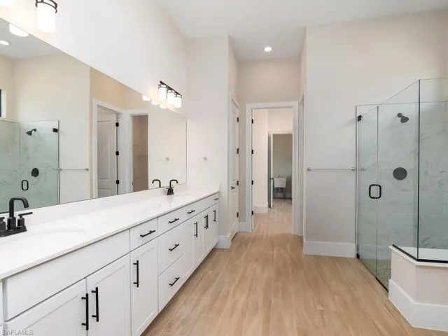 Owner bath leads directly to oversize closet which also has laundry room access.