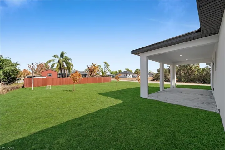 View of yard featuring a patio area and a residential view