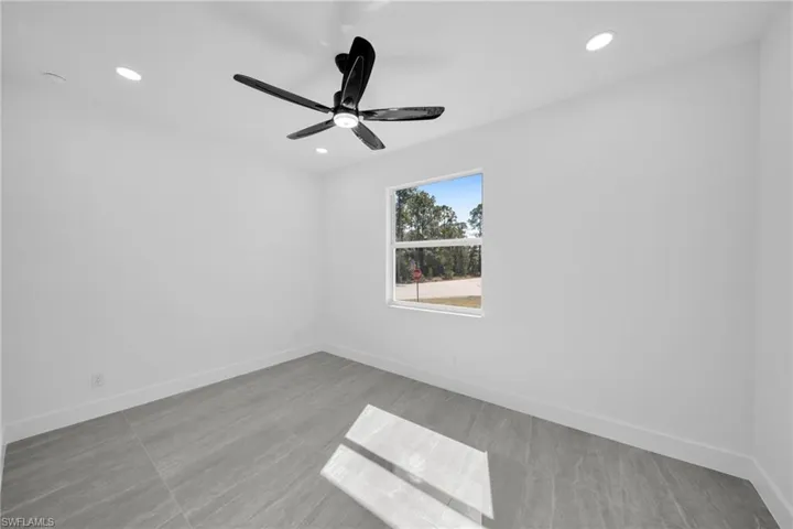 Spare room featuring a ceiling fan and recessed lighting