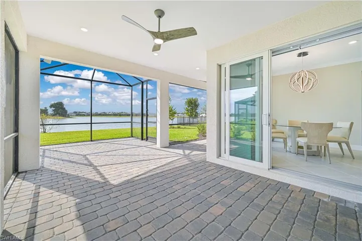 Unfurnished sunroom featuring a water view