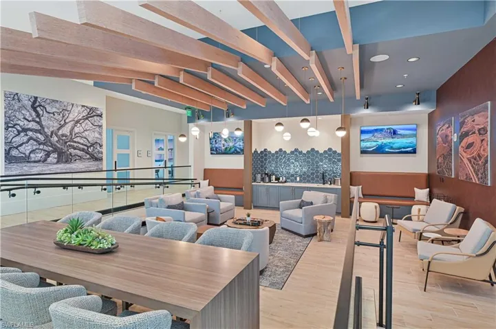 Community lobby featuring beam ceiling and recessed lighting