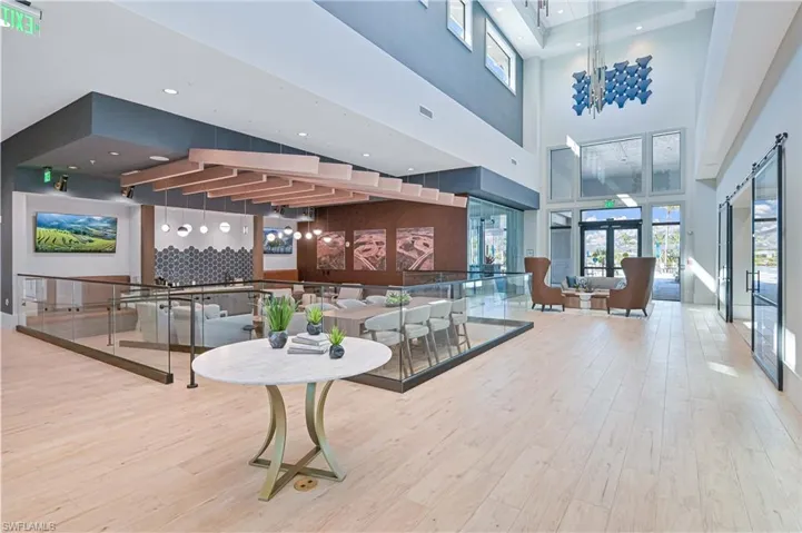 Community lobby with recessed lighting and a towering ceiling