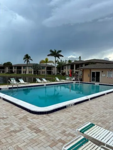 Community pool featuring a patio