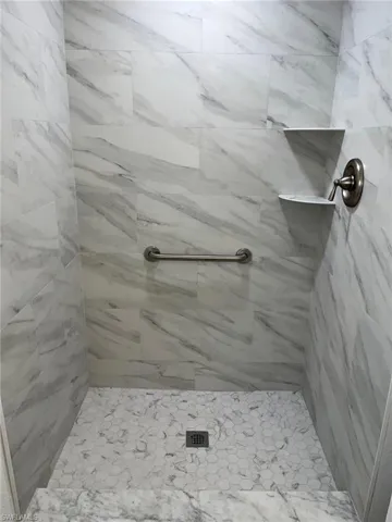 Bathroom with a tile shower