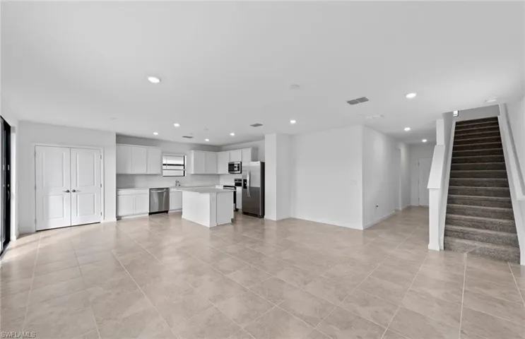 Unfurnished living room with recessed lighting