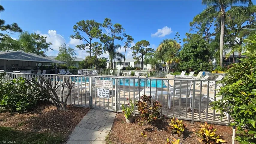 Pool featuring a patio area and fence