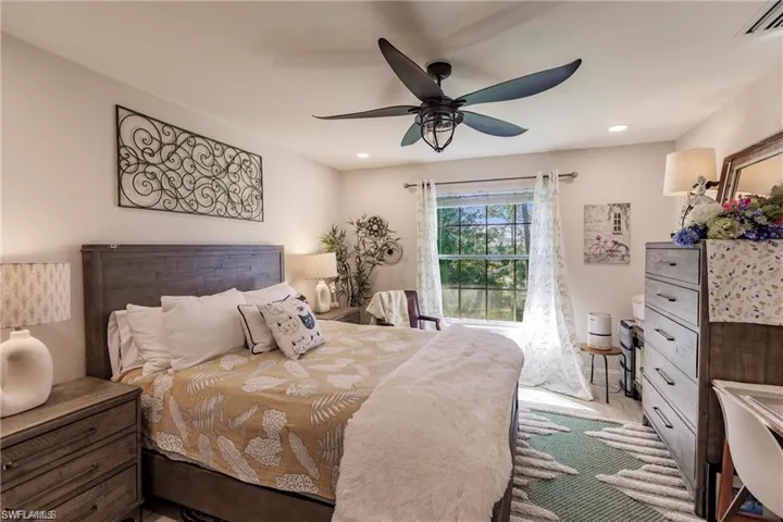 Bedroom featuring visible vents, recessed lighting, and a ceiling fan