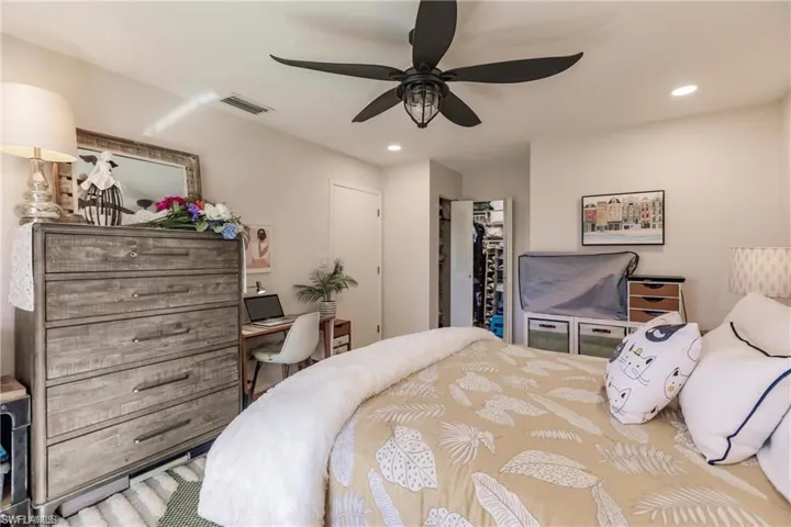 Living room with recessed lighting, a ceiling fan, baseboards, and wood finished floors