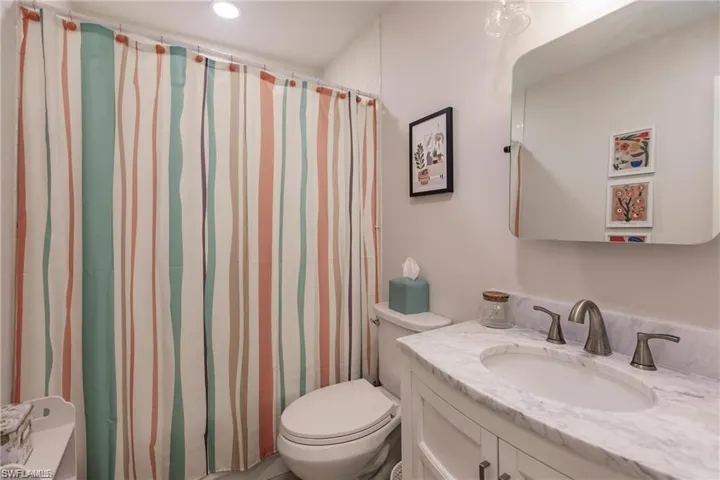 Bedroom featuring a ceiling fan, recessed lighting, and visible vents