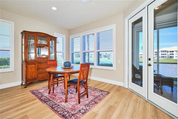 Dining space with light wood-type flooring, baseboards, and recessed lighting