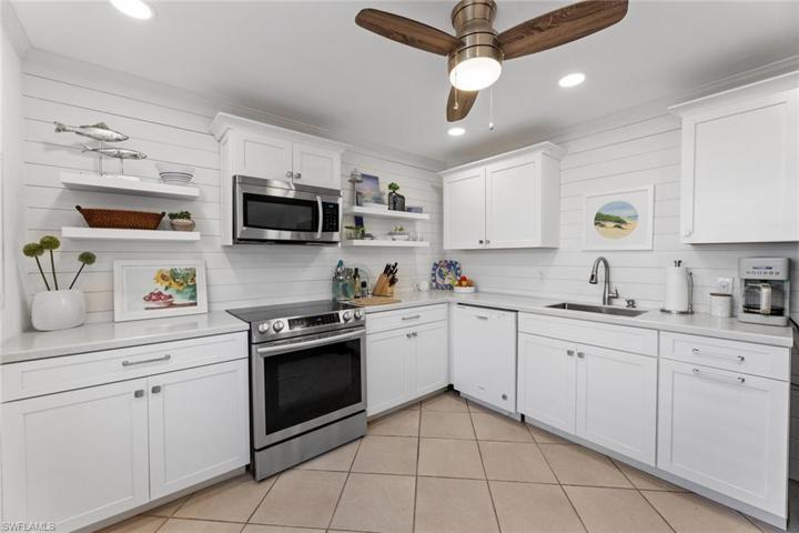 Coastal kitchen features great design and great workspace flow.