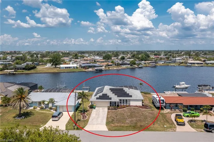Aerial view of residential area with a large body of water