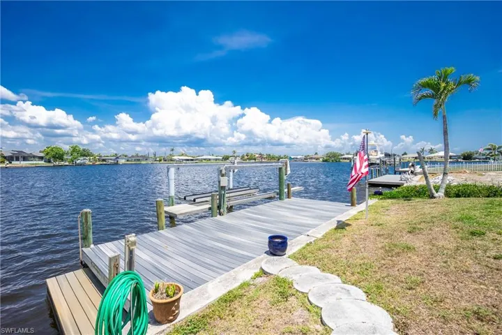 Dock featuring a water view and boat lift