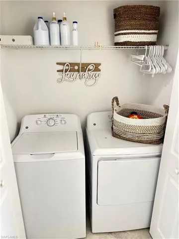 Laundry room featuring separate washer and dryer