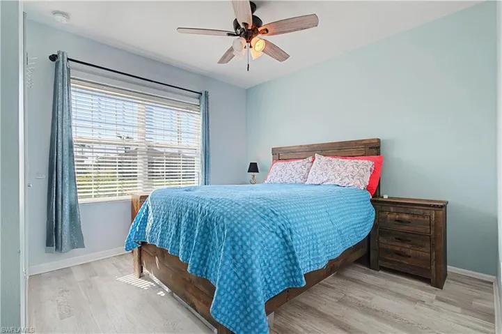 Bedroom featuring light wood-style floors and a ceiling fan