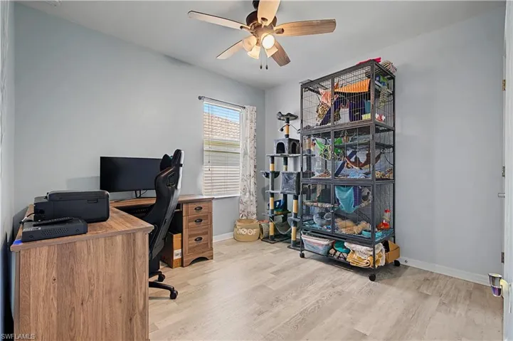 Office featuring light wood-style floors and ceiling fan