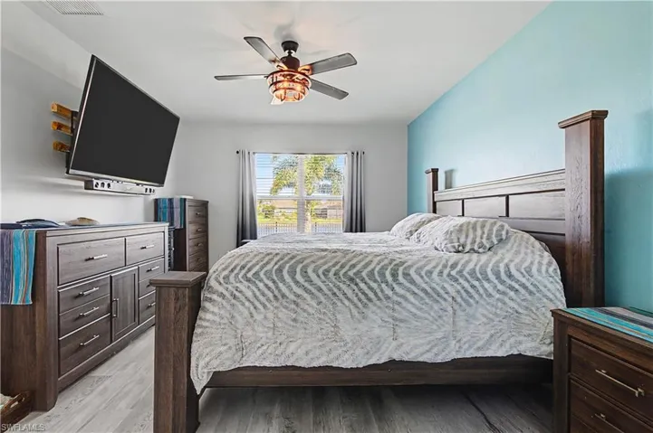 Bedroom with light wood-style flooring and ceiling fan