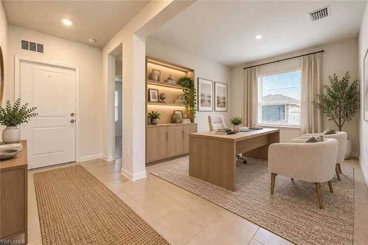 Entryway and office space featuring tile flooring, custom built-in cabinetry with integrated LED lighting, and large windows with horizontal blinds