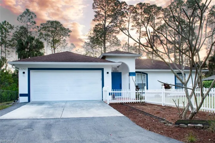 View of front of property with a garage
